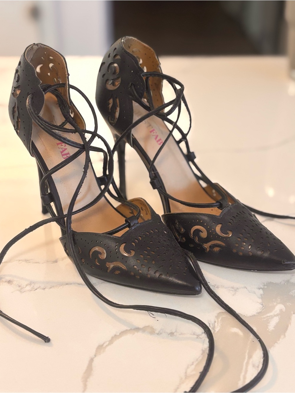 JustFab black laser-cut lace-up stiletto pumps